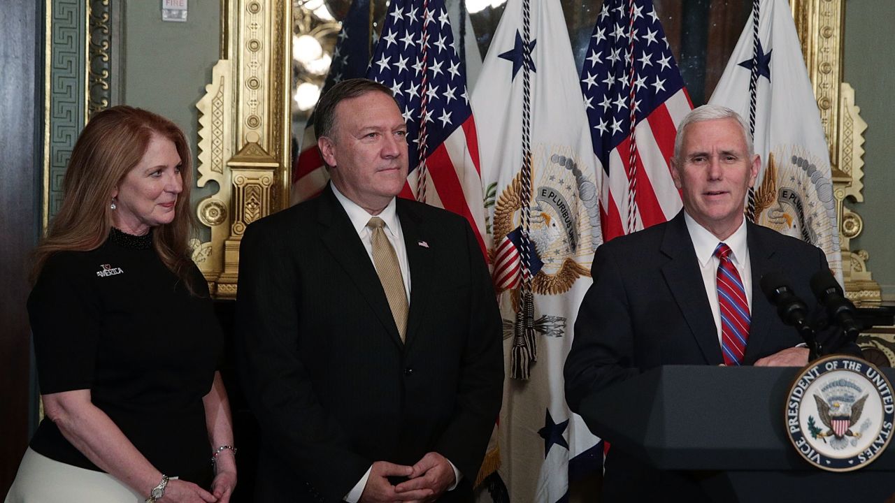 U.S. Vice President Mike Pence (R) speaks as Mike Pompeo (2nd L) and wife Susan Pompeo (L) look on during a swearing in ceremony for Pompeo to become CIA Director at Eisenhower Executive Office Building January 23, 2017 in Washington, DC. Pompeo was confirmed for the position by the Senate this evening.  (Alex Wong/Getty Images)