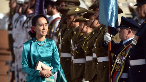 Myanmar's State Counsellor Aung San Suu Kyi, left, receives an official welcome on March 19, on the forecourt during her visit to Parliament House in Canberra, Australia.