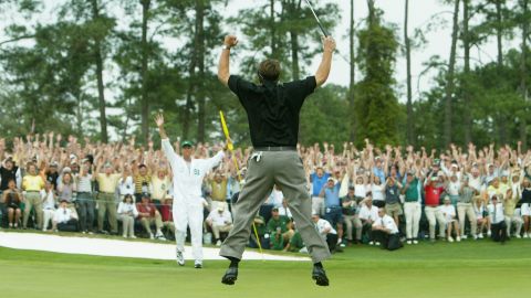 Mickelson reaches for the sky after winning his first major at the 2004 Masters.