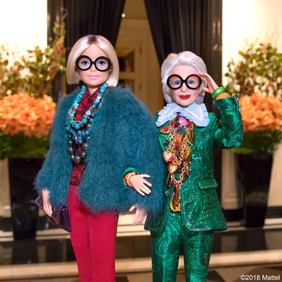 The Iris Apfel doll, complete with black-rimmed glasses.