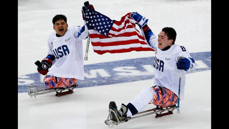 Ralph DeQuebec, left, and Jack Wallace celebrate after the US sled hockey team won gold at the Winter Paralympics on Sunday, March 18.