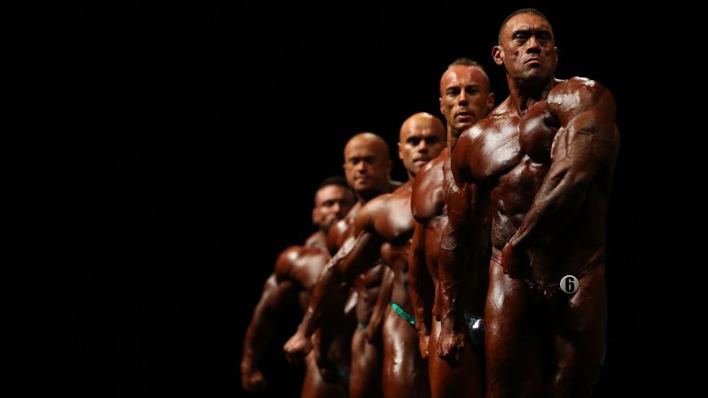 Bodybuilders pose in Melbourne during the Arnold Classic Pro Show on Saturday, March 17.