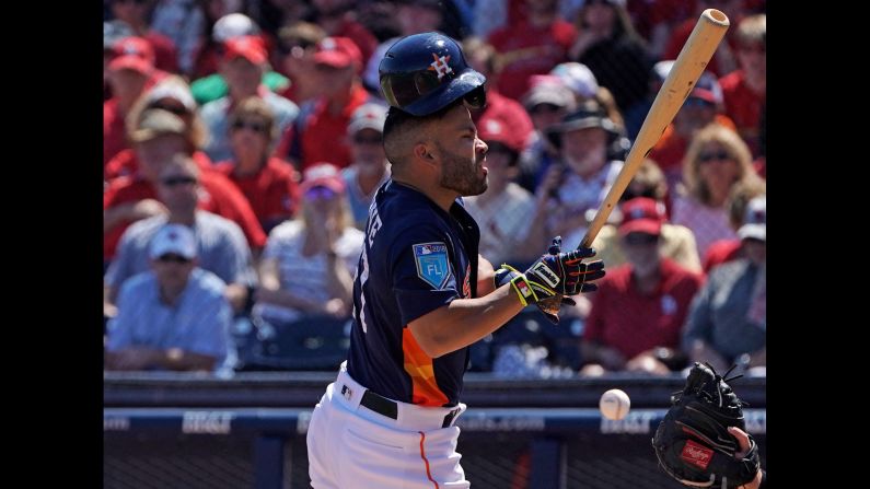 Houston's Jose Altuve, the American League's reigning MVP, is hit by a pitch during a spring-training game against St. Louis on Wednesday, March 14.