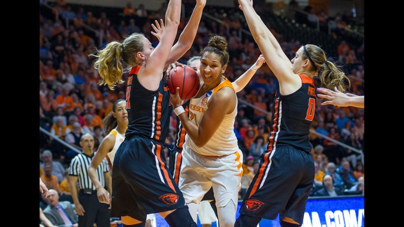Tennessee center Mercedes Russell, center, is guarded by Oregon State players during an NCAA Tournament game on Sunday, March 18. Oregon State upset Tennessee 66-59 to advance to the Sweet Sixteen.