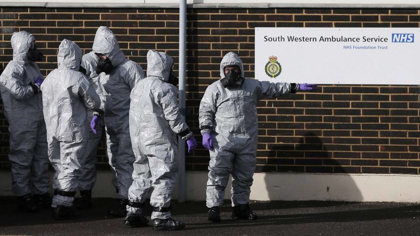 Personnel in protective coveralls and breathing equiptment cover an ambulance with a tarpaulin at the Salisbury District Hospital in Salisbury, southern England, on March 10, 2018, in connection with the major incident sparked after a man and a woman were apparently poisoned in a nerve agent attack.
British soldiers were deployed on March 9 to help a counter-terrorism investigation into a nerve agent attack on former Russian spy Sergei Skripal, as speculation mounted over how London could retaliate if the Russian state is found to be responsible. Skripal and his daughter Yulia remain unconscious in a critical but stable condition following the March 4 attack in the sleepy south-western English city of Salisbury. The Counter Terrorism Policing Network requested assistance from the military to remove a number of vehicles and objects from Salisbury.   / AFP PHOTO / Daniel LEAL-OLIVAS        (Photo credit should read DANIEL LEAL-OLIVAS/AFP/Getty Images)
