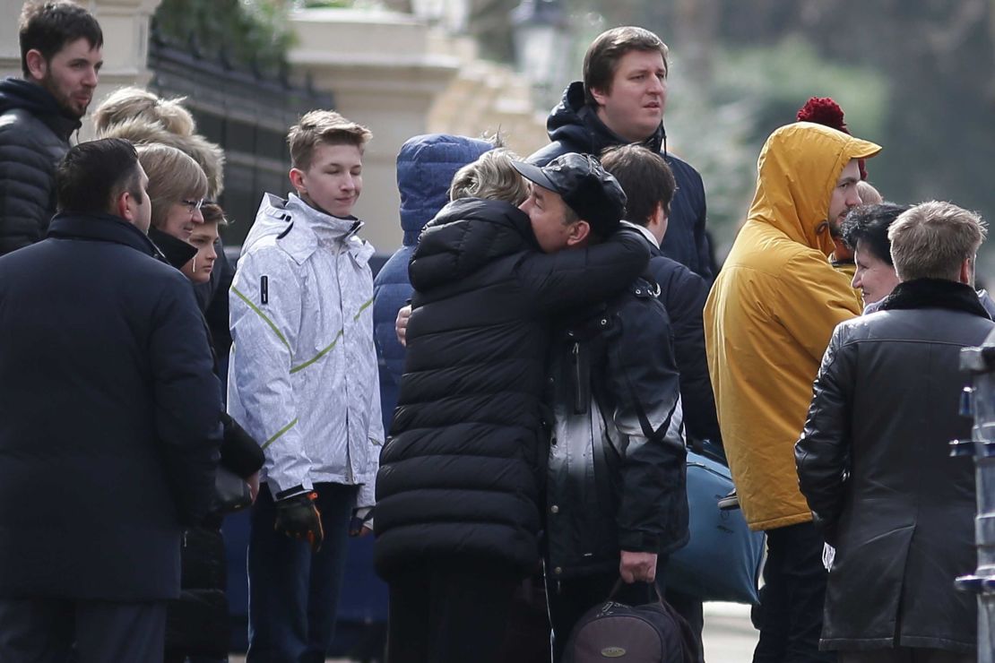 People hug last week at the Russian Embassy in London after the UK's expulsion of Russian diplomats.