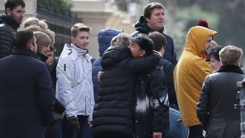People hug last week at the Russian Embassy in London after the UK's expulsion of Russian diplomats.