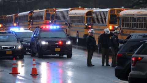 School buses lined up in front of Great Mills High School after a shooting on Tuesday to transport students to another school.