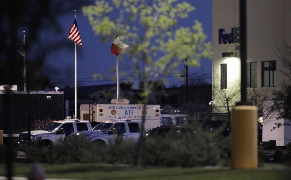 An ATF vehicle sits at a FedEx sorting center where a package exploded Tuesday in Schertz, Texas.