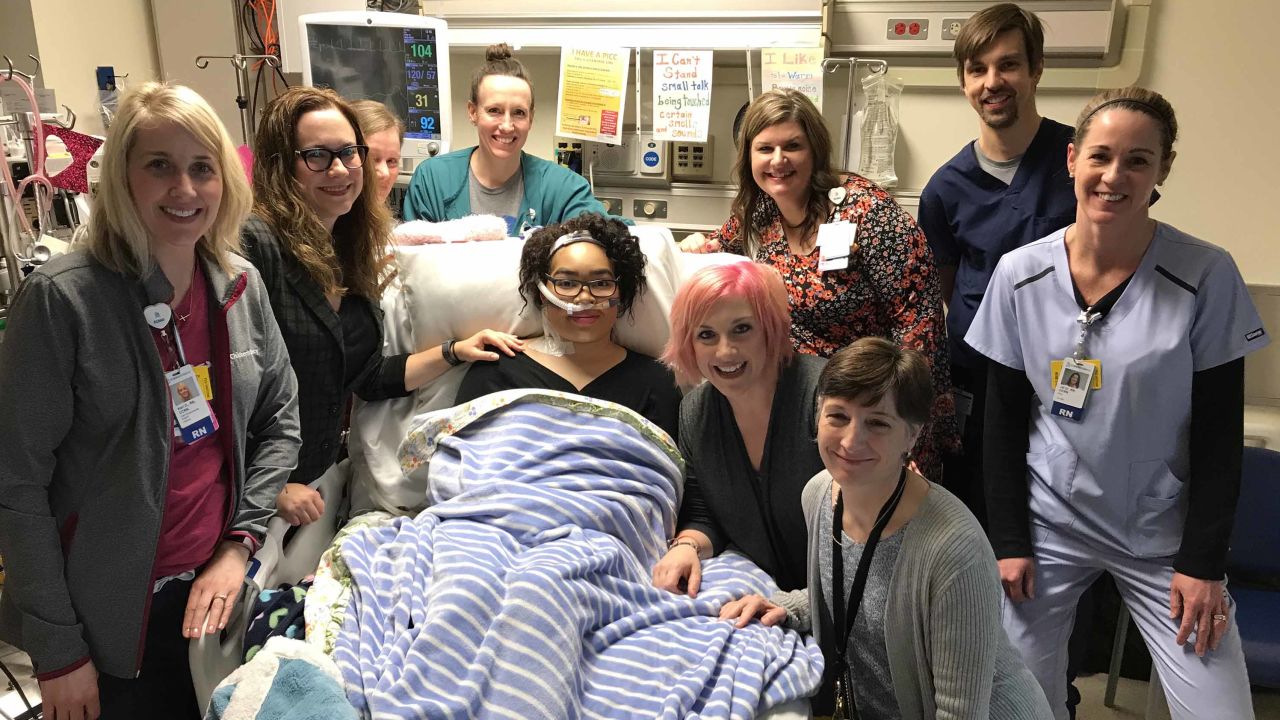 Zei Uwadia with her mother and medical team at Children's Mercy Kansas City. Clockwise from left are Kari Davidson, Dr. Jenna Miller, Ryanne Toland, Julie Pearson, Debbie Newton, Dr. Jay Rilinger, Jill Dinkel, Dr. Marita Thompson and Zei's mother, Brie Kerschen.
