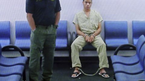 A shackled Zachary Cruz waits to make a court appearance via video on March 20.