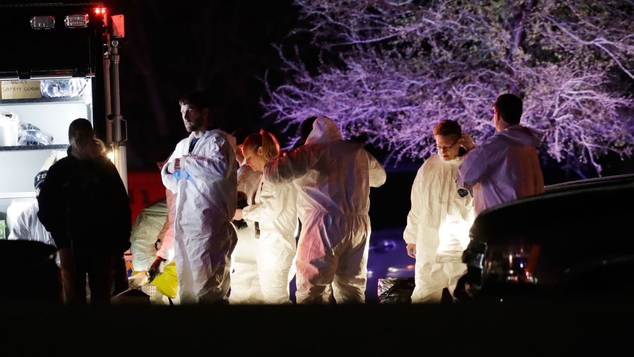 Members of law enforcement stage near the area where a suspect in a series of bombing attacks in Austin blew himself up as authorities closed in, Wednesday, March 21, 2018, in Round Rock, Texas. (AP Photo/Eric Gay)