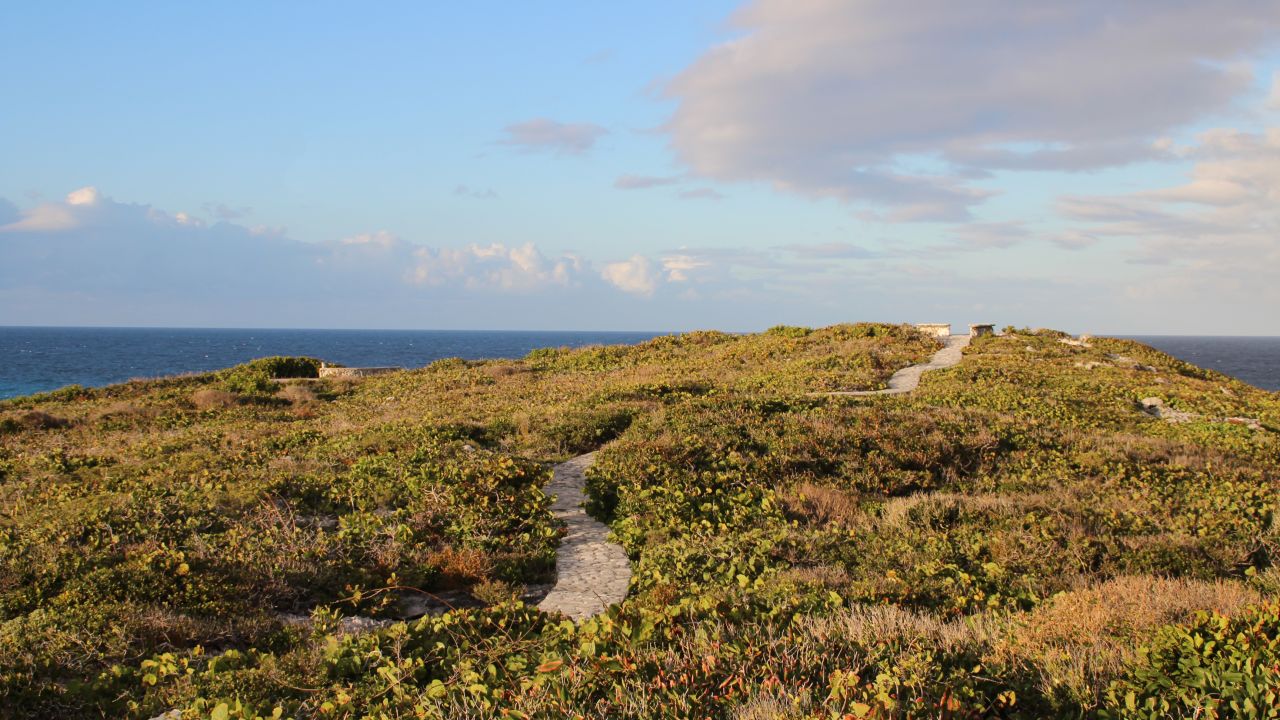 <strong>Dragon Cay Resort: </strong>Stone paths crisscross the cliffs above Mudjin Harbor connecting cottages at Dragon Cay Resort to clifftop viewing areas. The perches provide especially nice views of the sun rising over the water.