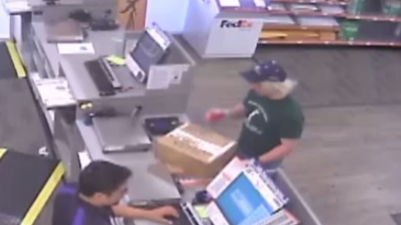 Surveillance video shows the bombing suspect, wearing a baseball hat, at a FedEx store.