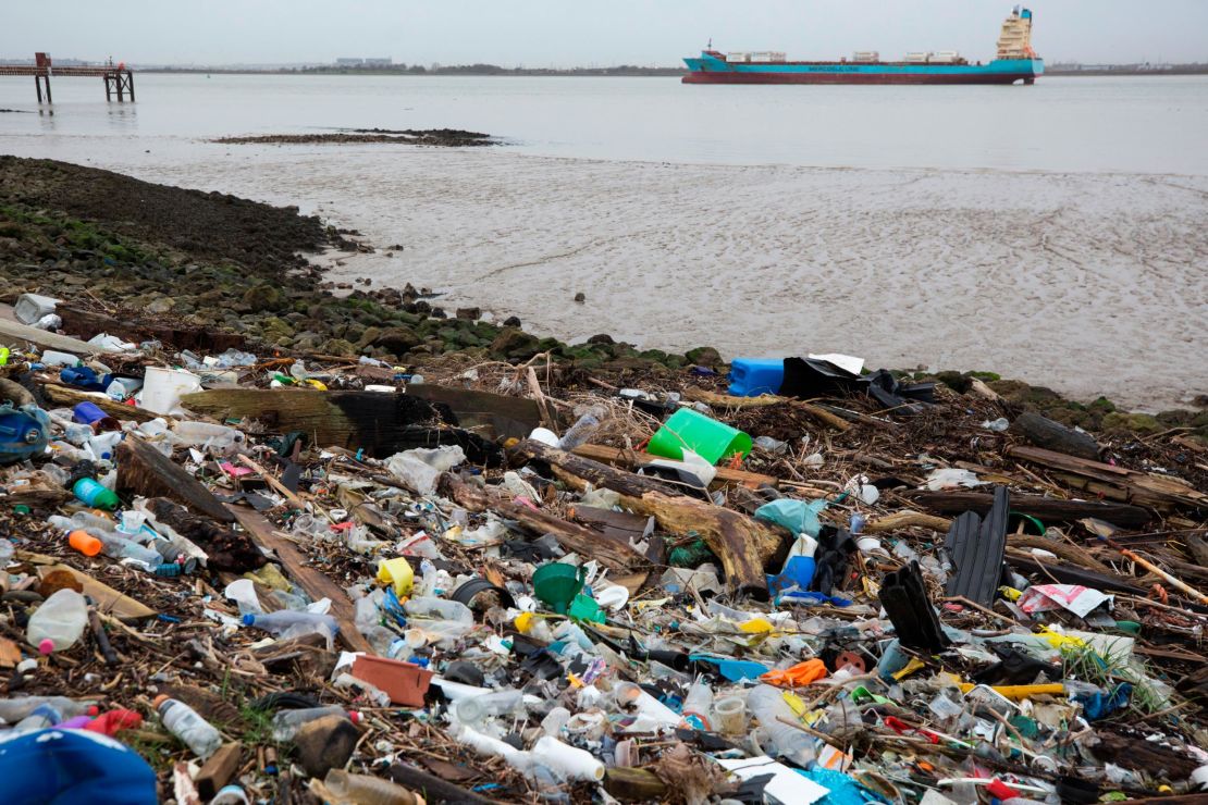 Plastics and other detritus line the shore of the Thames Estuary in Cliffe, Kent, UK.