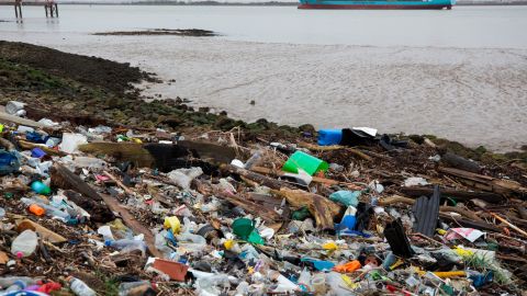 Plastics and other detritus line the shore of the Thames Estuary in Cliffe, Kent, UK.