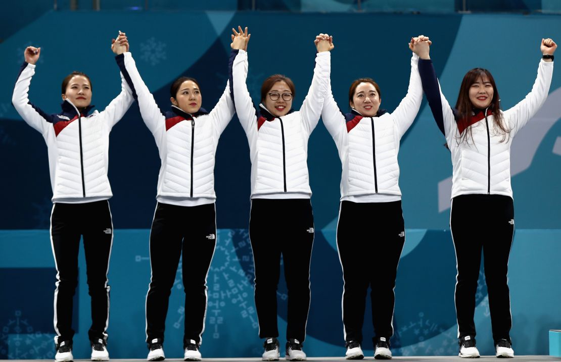 The Garlic Girls celebrate an historic silver medal on the Winter Olympic podium in Pyeongchang.