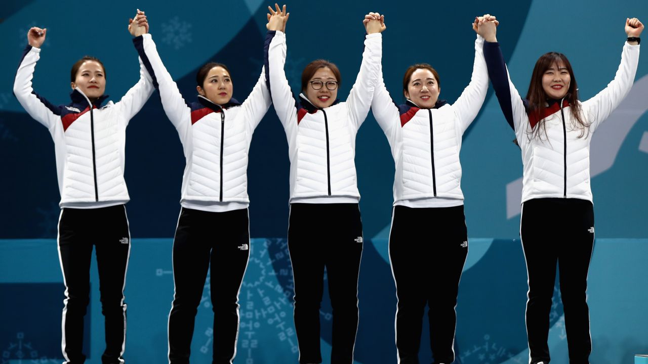 The Garlic Girls celebrate an historic silver medal on the Winter Olympic podium in Pyeongchang.