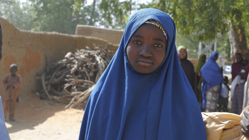 Aishat Alhaji , one of the kidnapped girls from the Government Girls Science and Technical College Dapchi who was freed, is photographed after her release,  in Dapchi, Nigeria, Wednesday March. 21, 2018. Witnesses say Boko Haram militants have returned an unknown number of the 110 girls who were abducted from their Nigeria school a month ago. (AP Photo/Jossy Ola)