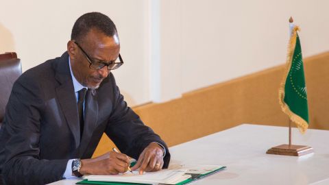 Rwanda's President Paul Kagame signs an agreement for establishing the African Continental Free Trade Area.