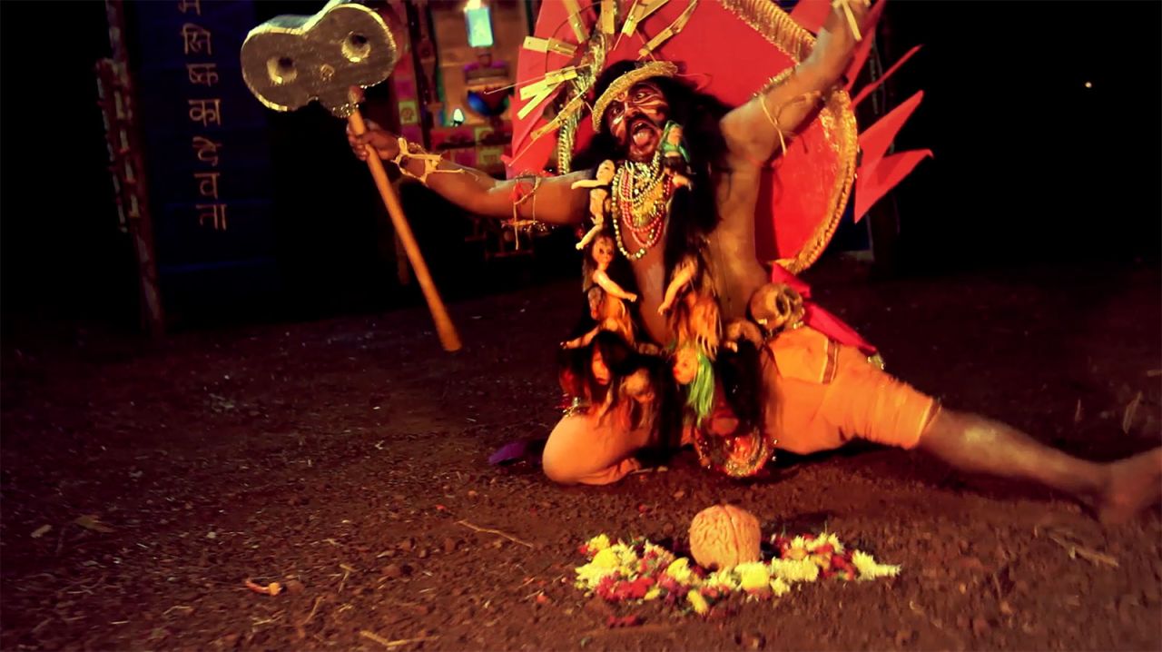 "God of the Brain," produced by Lu during her residency at Khoj International Workshop in Goa last year. The video features Veeragase, a traditional Indian dance based on Hindu mythology.