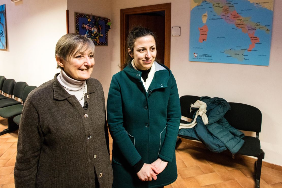 Daniela Pompei, left, and Nour Essa at the Community of Sant'Egidio office in Rome. After fleeing war in Syria, Essa and her family were brought from a refugee camp in Greece to Vatican City by the Pope.
