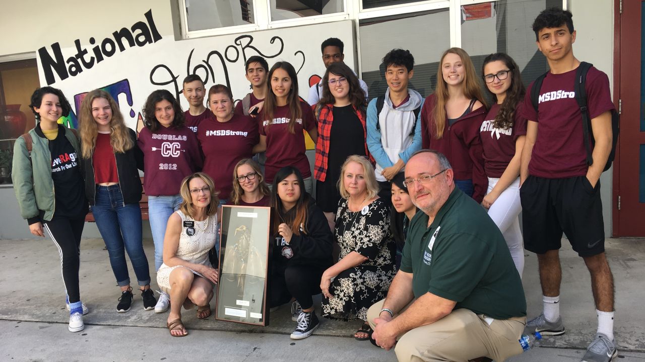 Joanne Avery, front row at left, presented the dreamcatcher to Marjory Stoneman Douglas High School. They only accepted it for 17 seconds.