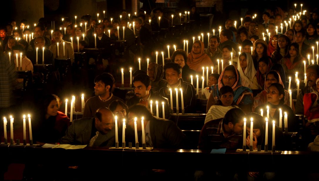 Pakistani Christians offer prayers during a Christmas function at the Cathedral church in Lahore in 2009. 