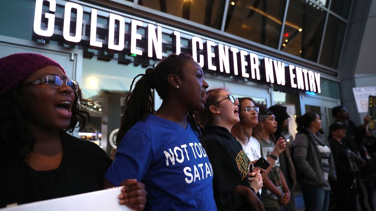 SACRAMENTO, CA - MARCH 22:  Black Live Matter protesters chant as they block the entrance to the Golden 1 Center during a demonstration on March 22, 2018 in Sacramento, California.  Hundreds of protesters staged a demonstration against the Sacramento police department after two officers shot and killed Stephon Clark, an unarmed black man, in the backyard of his grandmother's house following a foot pursuit on Sunday evening.  (Photo by Justin Sullivan/Getty Images)