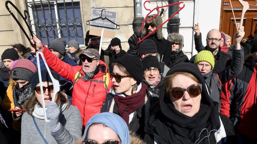People hold up coat hangers as they demonstrate in front of the seat of the Warsaw archdiocese on March 18, 2018 in a protest against what they call the Catholic Churchs intrusion into politics by supporting a new measure to tighten the already restrictive law on abortion. / AFP PHOTO / JANEK SKARZYNSKI        (Photo credit should read JANEK SKARZYNSKI/AFP/Getty Images)