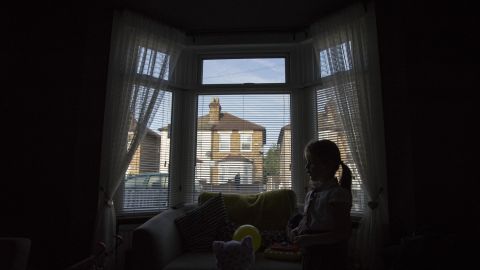 Leatherbarrow's older daughter, 6-year-old Gwen, is silhouetted against their front window.