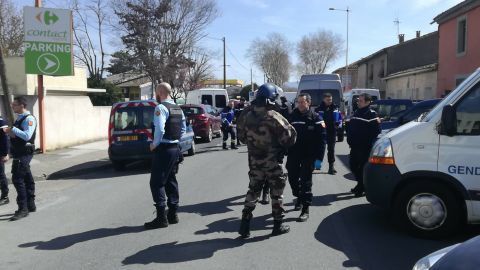 Police respond to the supermarket siege Friday in Trèbes.