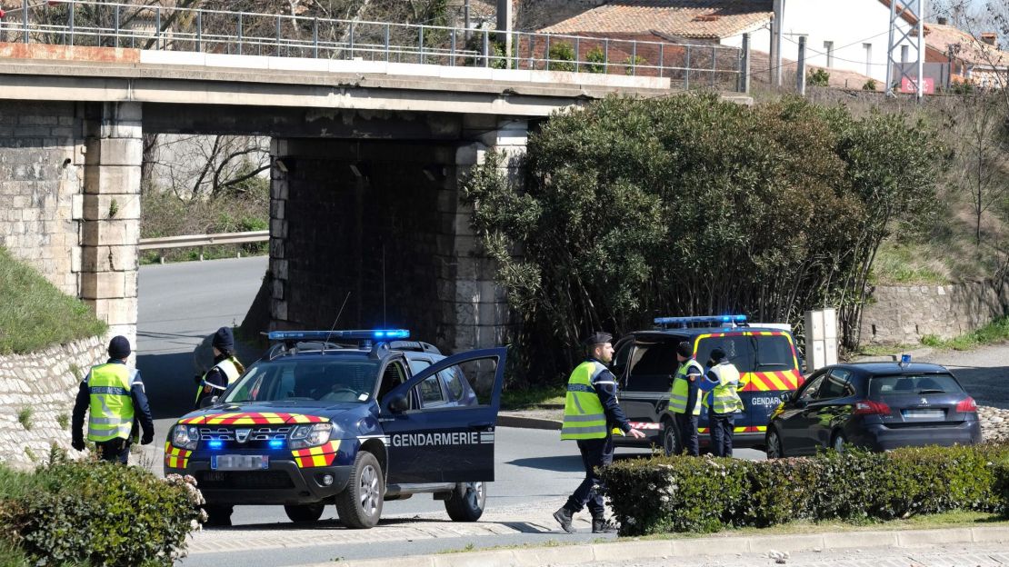 French police block access to Trèbes as they respond to the hostage situation Friday.