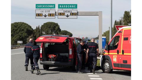 French police and firefighters secure parts of Trèbes on Friday.