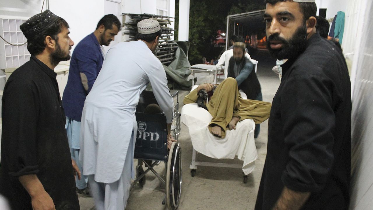 A wounded man is taken to a hospital after the Helmand car bombing.