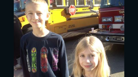 Lauren, then 6, and her brother Dalton photographed at the firehouse where they were taken after the school shooting. At that point, they didn't know anyone had been killed.