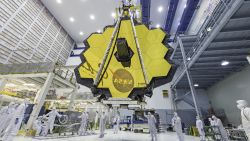 It's springtime and the deployed primary mirror of NASA's James Webb Space Telescope looks like a spring flower in full bloom.
 
In this photo, NASA technicians lifted the telescope using a crane and moved it inside a clean room at NASA's Goddard Space Flight Center in Greenbelt, Maryland. Once launched into space, the Webb telescope's 18-segmented gold mirror is specially designed to capture infrared light from the first galaxies that formed in the early Universe, and will help the telescope peer inside dust clouds where stars and planetary systems are forming today.
 
The James Webb Space Telescope is the scientific successor to NASA's Hubble Space Telescope. It will be the most powerful space telescope ever built. Webb is an international project led by NASA with its partners, ESA (European Space Agency) and the Canadian Space Agency.