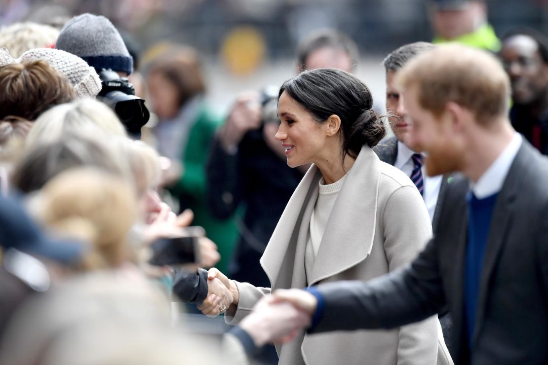 Prince Harry and Meghan Markle interact with the crowd during their visit to Northern Ireland.