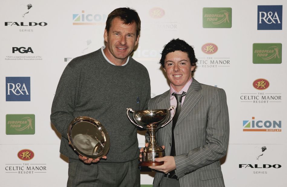 <strong>Standout junior:</strong> The young Northern Irishman was a child prodigy. He won the World U10 title and here poses with six-time major champion Nick Faldo after winning the Under 17 Division of the 2006 Faldo Junior Series at Celtic Manor in Wales.
