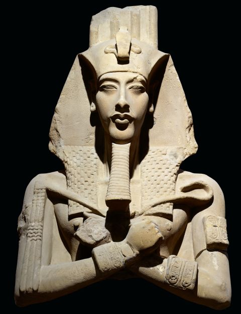 This statue, one of the colossal statues that originally stood in front of the pillared hall of the Temple of the Aten at Karnak, presents the king wearing the royal nemes-headdress with a uraeus at the forehead. 