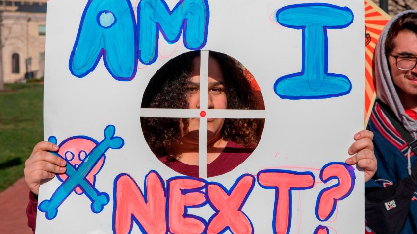 A student from Baltimore, Maryland, holds a protest sign during the March for Our Lives Rally in Washington, DC on March 24, 2018. 
Galvanized by a massacre at a Florida high school, hundreds of thousands of Americans are expected to take to the streets in cities across the United States on Saturday in the biggest protest for gun control in a generation. / AFP PHOTO / Alex Edelman        (Photo credit should read ALEX EDELMAN/AFP/Getty Images)