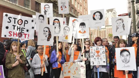 Women carry signs at the Los Angeles March for Our Lives event.