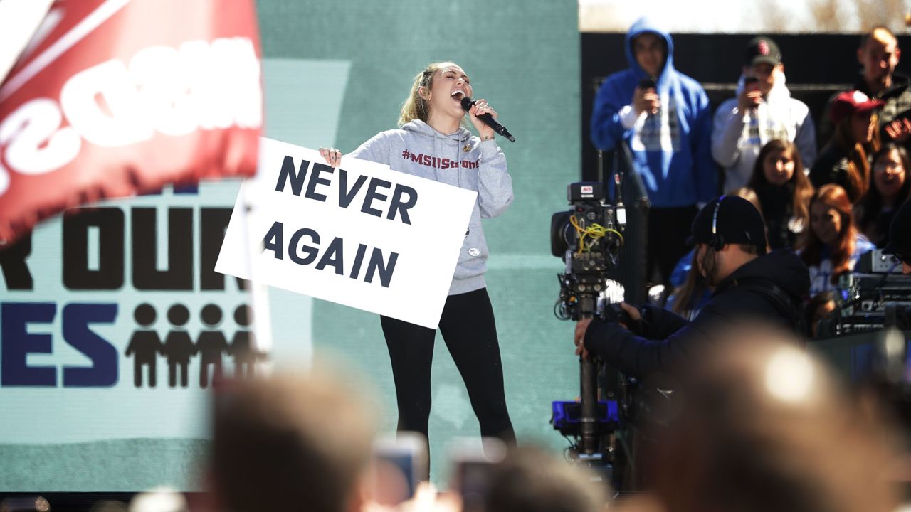 Miley Cyrus performs "The Climb" during the March for Our Lives rally on March 24, 2018 in Washington.