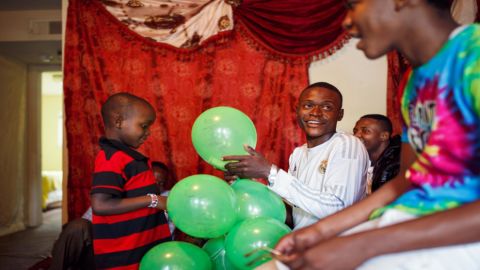 Abdalla's children filled balloons with money to welcome their oldest brother, Ramadhan, to the United States. The day before, the family panicked when they heard fireworks for the first time. (Melissa Golden/Redux for CNN)