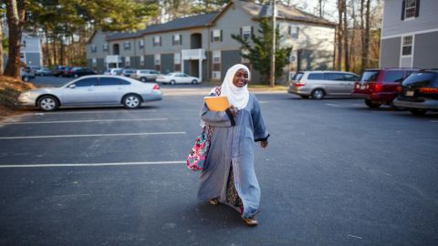 Batulo walks to school in the morning. Once she gets her GED, she hopes to study to become a nurse. (Melissa Golden/Redux for CNN)