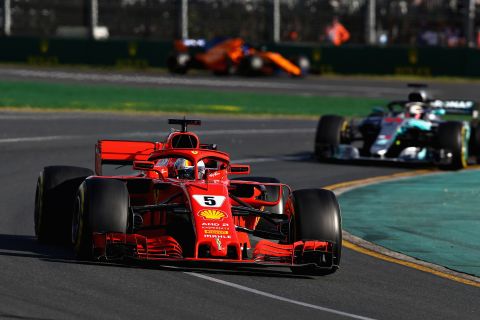 Sebastian Vettel took full advantage of a bizarre incident involving both cars of the American-owned Haas team to claim the opening race of the 2018 Formula One season in Australia.