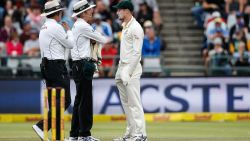 Australian fielder Cameron Bancroft (R) is questioned by Umpires Richard Illingworth (L) and Nigel Llong (C) during the third day of the third Test cricket match between South Africa and Australia at Newlands cricket ground on March 24, 2018 in Cape Town. / AFP PHOTO / GIANLUIGI GUERCIA        (Photo credit should read GIANLUIGI GUERCIA/AFP/Getty Images)