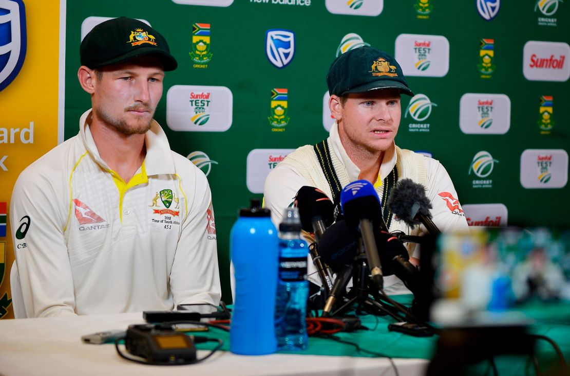 Smith (capt) and Bancroft (L) face the media.