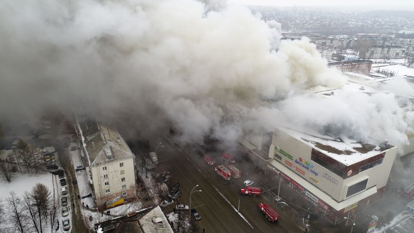In this Russian Emergency Situations Ministry photo, on Sunday, March 25, 2018, smoke rises above a multi-story shopping center in the Siberian city of Kemerovo, about 3,000 kilometers (1,900 miles) east of Moscow, Russia. At least three children and a woman have died in a fire that broke out in a multi-story shopping center in the Siberian city of Kemerovo. (Russian Ministry for Emergency Situations photo via AP)