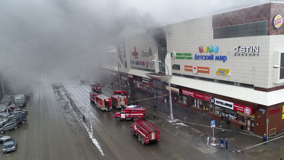 Smoke rises above a multi-story shopping center in the Siberian city of Kemerovo on March 25.